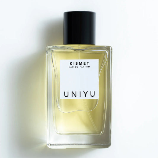 KISMET by UNIYU, born in Australia, crafted in France, features a rich blend of saffron, rose, patchouli, leather, and oud in a sleek minimalist bottle.