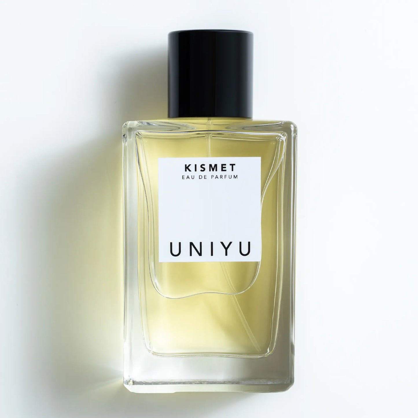 KISMET by UNIYU, born in Australia, crafted in France, features a rich blend of saffron, rose, patchouli, leather, and oud in a sleek minimalist bottle.