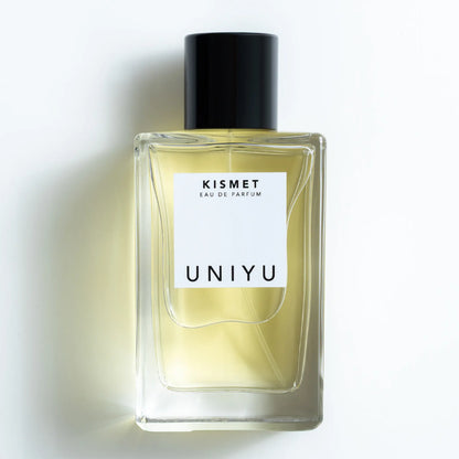 KISMET by UNIYU, born in Australia, crafted in France, features a rich blend of saffron, rose, patchouli, leather, and oud in a sleek minimalist bottle.